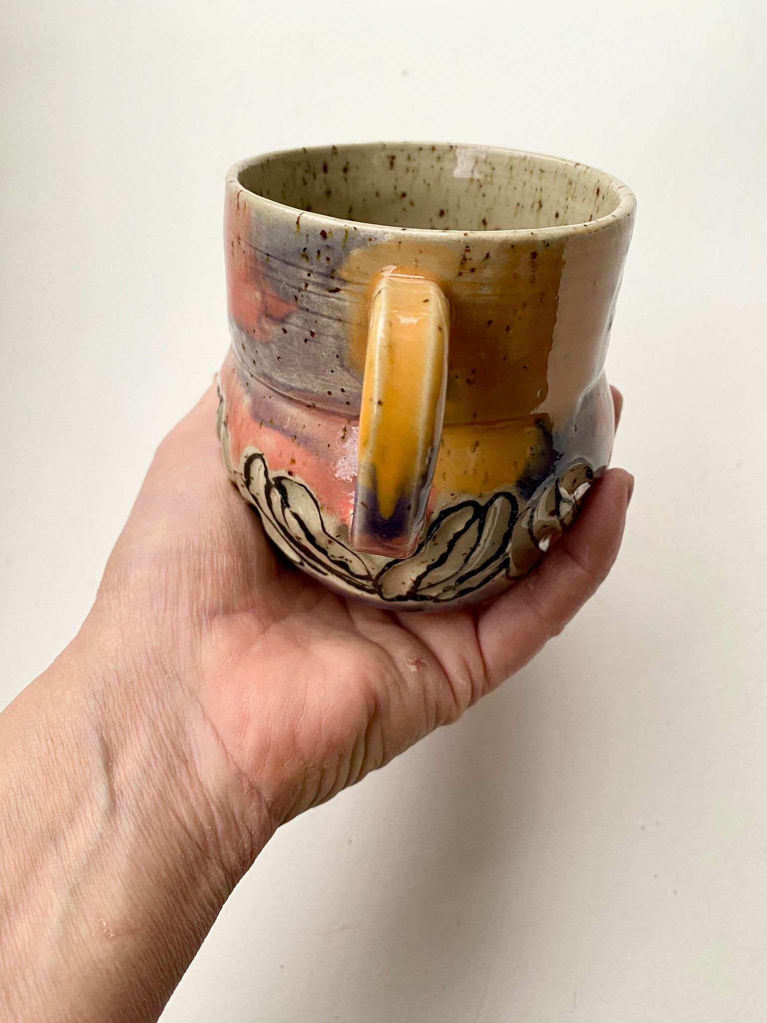 Tasse gelb / lachs / türkis / lila