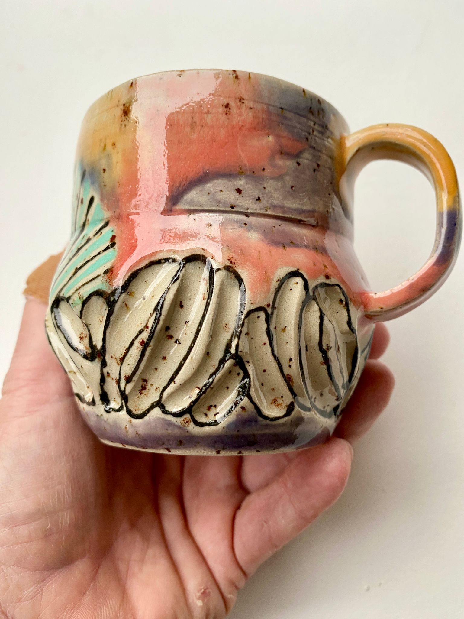 Tasse gelb / lachs / türkis / lila