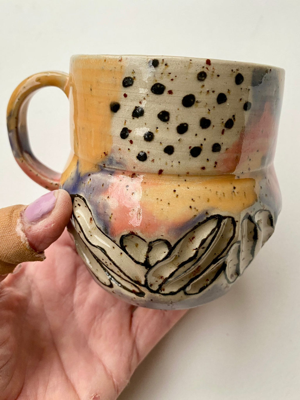 Tasse gelb / lachs / türkis / lila